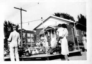 Family inspecting county fair exhibit