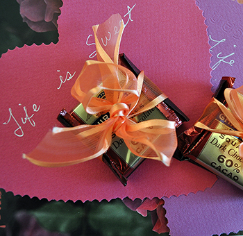 Dark chocolate with orange ribbon and heart