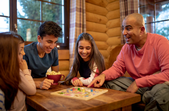 family playing board game