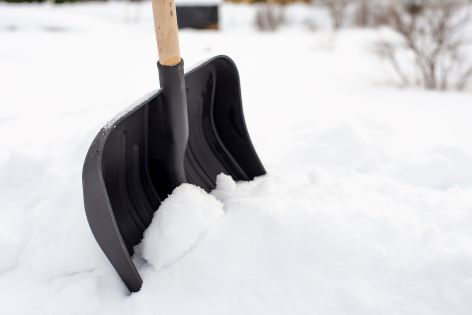 snow shovel in drift 